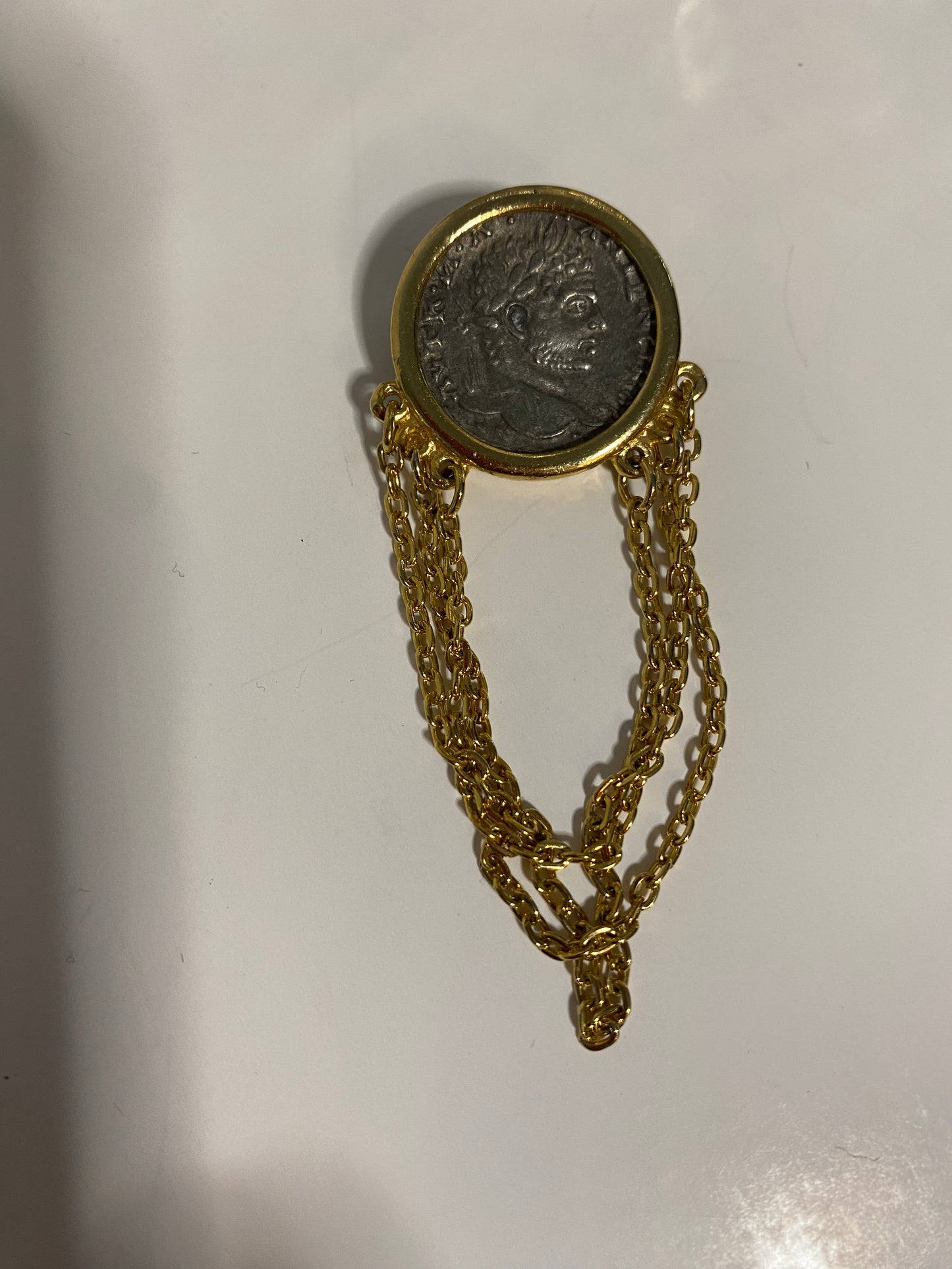 Coin w/chains brooch